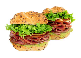 German style salami and cheese filled sandwich rolls with fresh lettuce and guacamole isolated on a white background