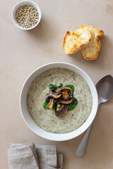 Cream soup with mushrooms and spinach. Healthy eating. Vegetarian food.