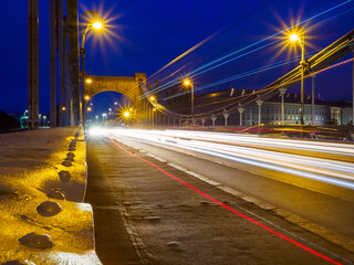 Fototapeta na wymiar Night time traffic in a city. Urban life, Public transportation