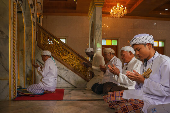muslim people pray in islam ceremony in mosque during islamic ramadan
