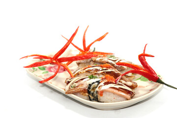 Healthy Home Cooking - Grilled pork sushi placed on a white plate, is a Japanese style Thai food on a white background and is sold at Thailand and every festival.