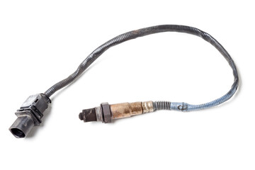 Lambda probe - oxygen sensor device designed to record tamount of remaining oxygen in the exhaust gas of car engine is located in exhaust system. Metal spare part for replacement to repair in workshop