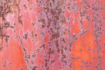 Metal surface for the backdrop. Old paint with rust and scratches. Red color.
