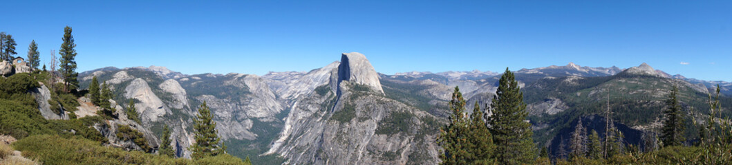 Fototapeta na wymiar Panorama Nature Landscape view of Half Dome Yosemite rock - is beautiful white grey rock seen from Glacier Point at Yosemite National Park Wawona Rd, California, USA 
