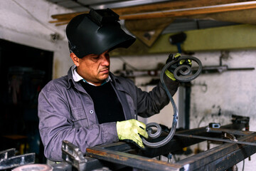 Blacksmith Forging Metal in Workshop