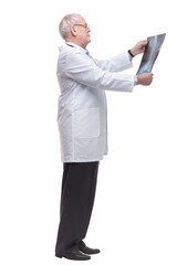 side view. the therapist carefully looking at the x- ray