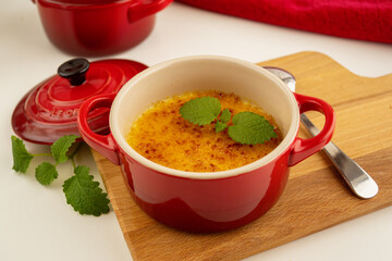 Cream Brulee in a red bowl. Dessert