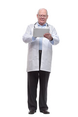 in full growth. senior doctor with a digital tablet