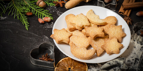 Christmas homemade gingerbread cookies on a white table top view.   Festive homemade gingerbread cookies. Christmas time. Traditional Christmas cookies
