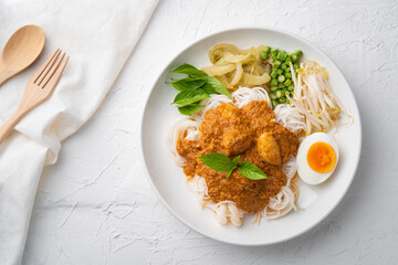 Rice noodles in fish curry sauce with meatball and vegetable (Kanom Jeen Nam Ya).Top view