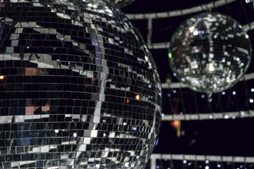 Silvery Mirror ball for Illumination on decoration construction. Close-up with limited depth of field.