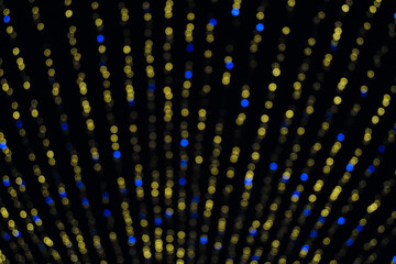 Blurred abstract running led colored lights. Color Bokeh at Night. Christmas garlands with led...