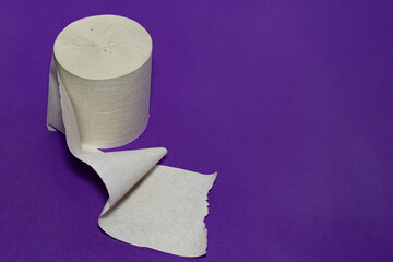 A roll of toilet paper on a purple background.