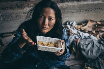 poor people,homeless or beggar begging for help sitting at dirty slum.concept for poverty...