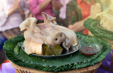 Boiled pig's head and offerings