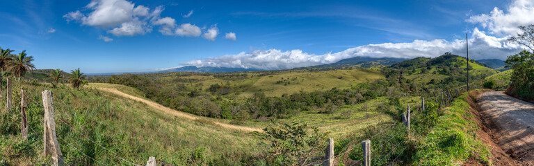 Fototapeta na wymiar Panoramic view of a typical Costa rican landscape, field, farmland andcoffee culture, Alajuela, Costa Rica