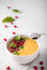 mango and pomegranate smoothie with mint leaves