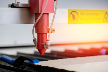 Laser CNC cutting wood. Modern machine industrial technology