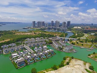 Emerald Bay residences on man-made island, aerial photography with bungalow houses and villas near...