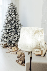 Fototapeta na wymiar white snowy Christmas tree decor home New Year postcard