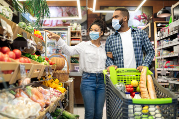 African American Couple Doing Grocery Shopping Together Buying Food