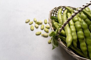 Basket full of freshly harvested broad beans.