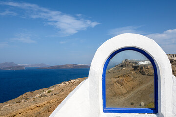 White blue window with view of the cliffs and caldera on the island of Santorini, Greece