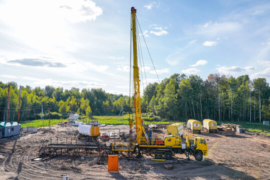 Special equipment for drilling an oil well in an oil field. Workover rig working on a previously drilled well trying to restore production through repairIn a row are oil-producing wells