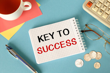 Business concept - notebook writing Key to success