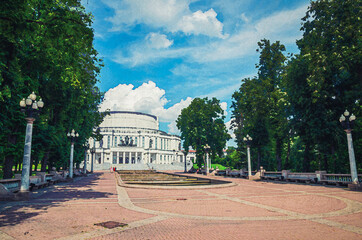 Watercolor drawing of Minsk: The National Academic Grand Opera and Ballet Theatre building in park in Trinity Hill district of historical city centre, blue sky white clouds in sunny summer day