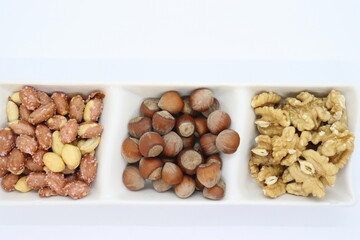 shelled hazelnuts, walnuts and salted peanuts, mixed nuts.