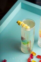 Cocktails. Traditional American drinks made by artisanal bartenders or mixologists in speakeasy & upscale bars or dives or taverns. Cocktails served in chilled cocktail glasses & garnished with fruit.