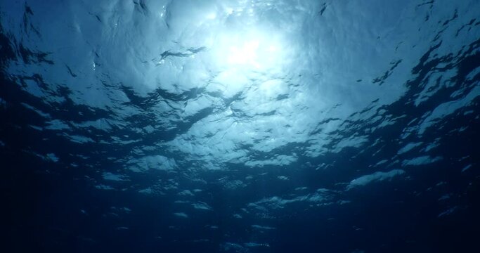 sun ray and sun beam scenery underwater waves on surface of water slow ocean scenery