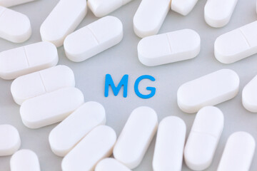 Magnesium tablets around the symbol Mg