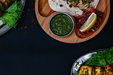  black table with indian dishes