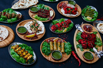 black table with indian dishes