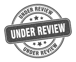 under review stamp. under review label. round grunge sign