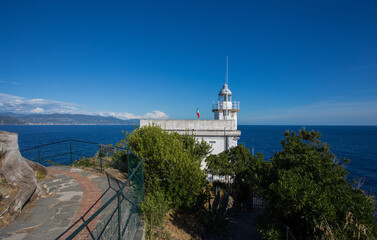 Fototapeta na wymiar The white lighthouse of Portofino, Ligurian coast, Genoa province, Italy.