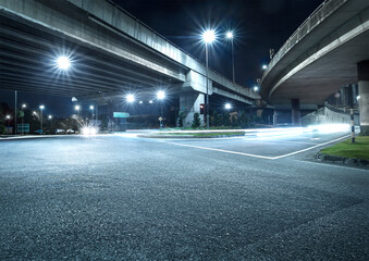 Fototapeta na wymiar Freeway in night with cars light in crossroads