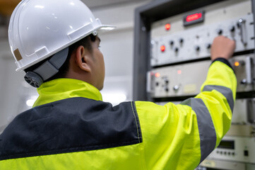 Electrical engineer woman checking voltage at the Power Distribution Cabinet in the control room,preventive maintenance Yearly,Thailand Electrician working at company