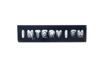 Embossed letter in word interview on black banner with white background