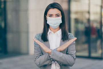 Photo of serious businessperson wear mask blazer formalwear suit show stop sign crossed hands in...