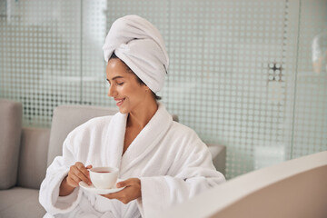 Client ready to make a sip of tea