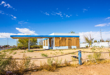 Old Abandoned Gas Station Commercial Building With Boarded Up Windows