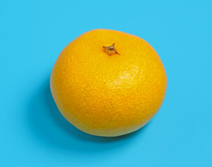 orange fruit on blue