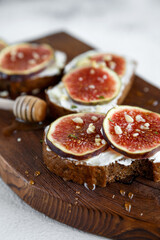 bruschetta with figs and honey and 
nuts. Hight key
