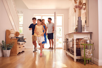 Family Looking Around New Home Before They Move In