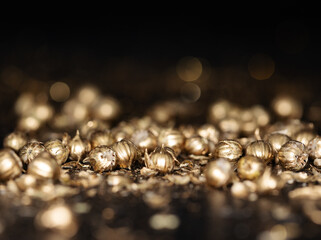 Shining golden particles abstract background. Blurred bokeh background of gold dust particles...