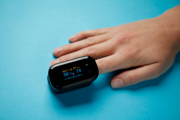 Fingertip oximeter. Checking the oxygen level in the blood for pneumonia.