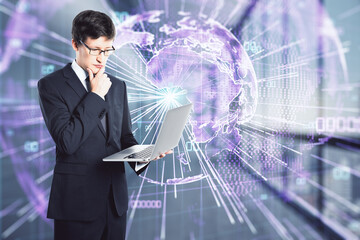 Businessman with laptop thinking about global digital transformation, big data concept
